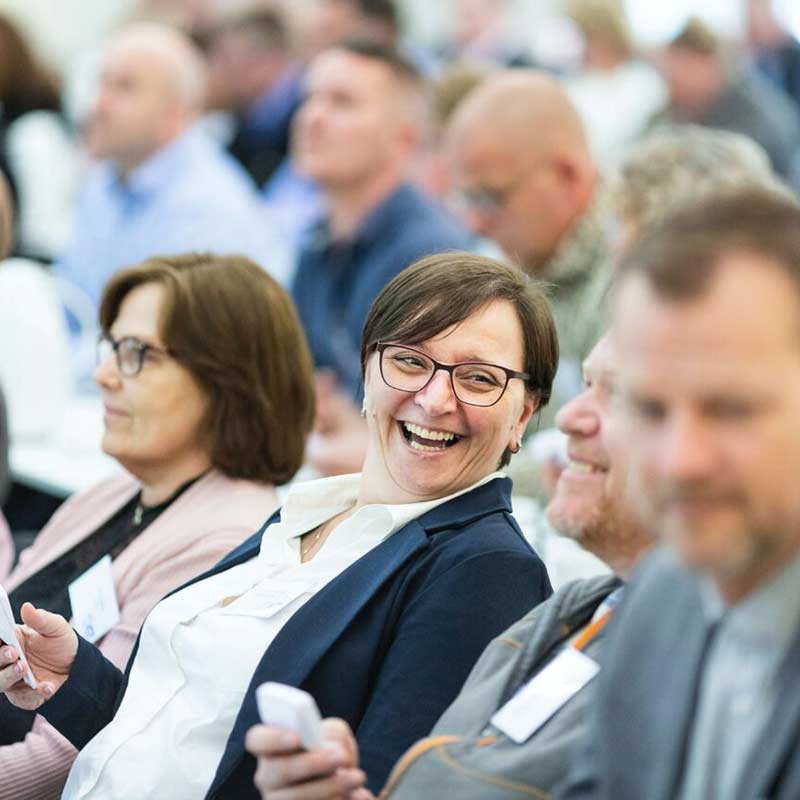 Woman laughing in audience